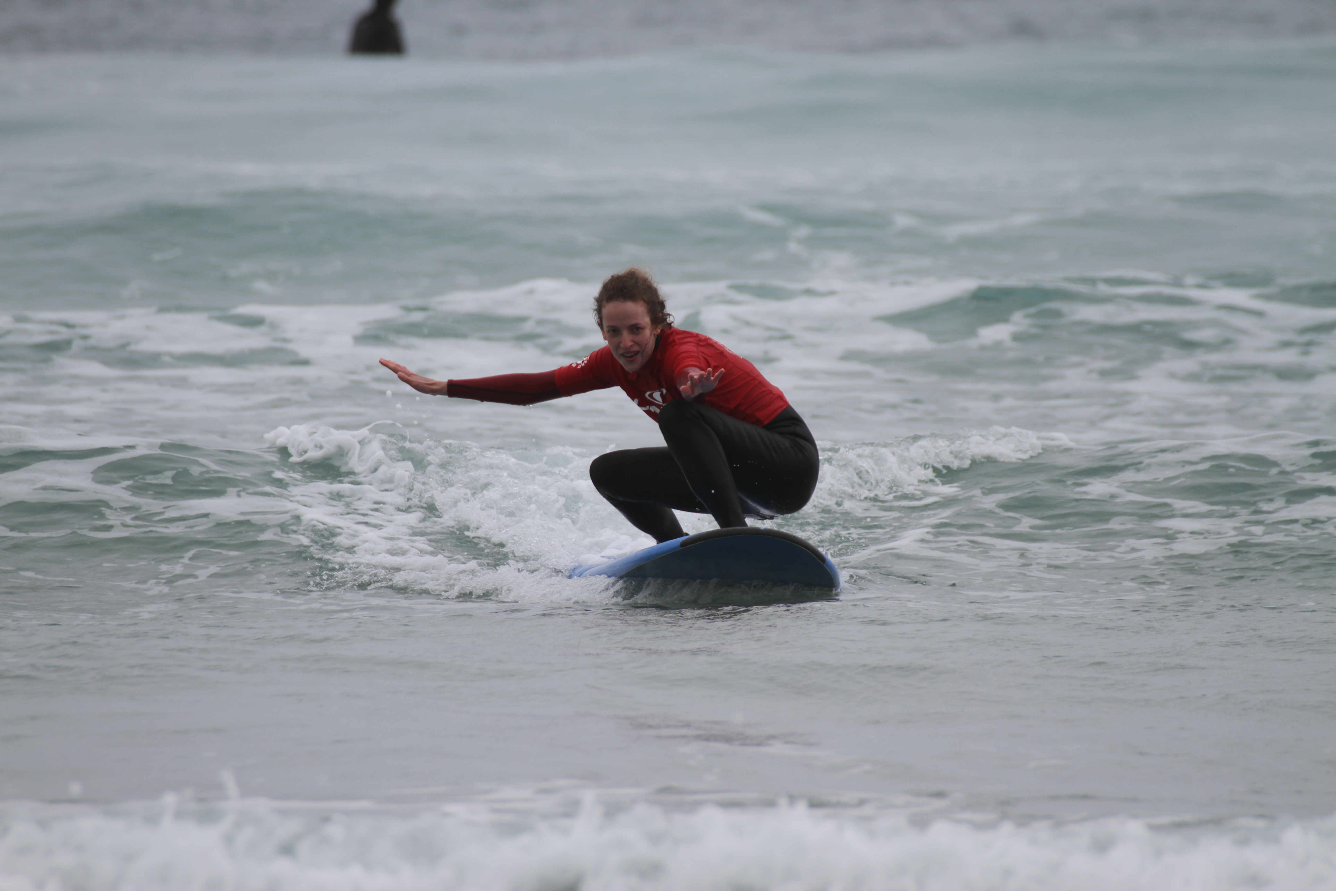 Linnie rides a wave